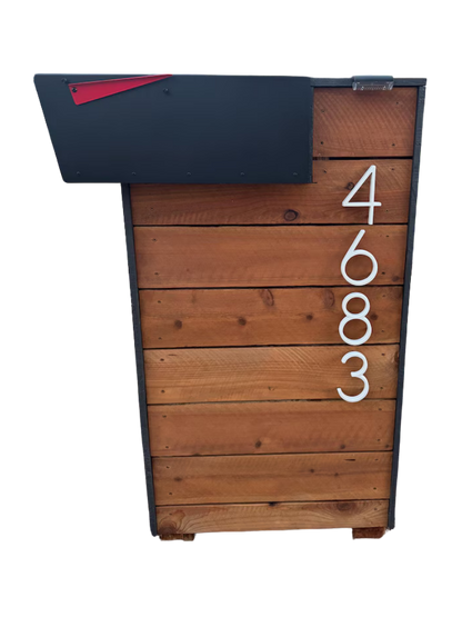 Wooden mailbox post with a black top and white address numbers on a white background