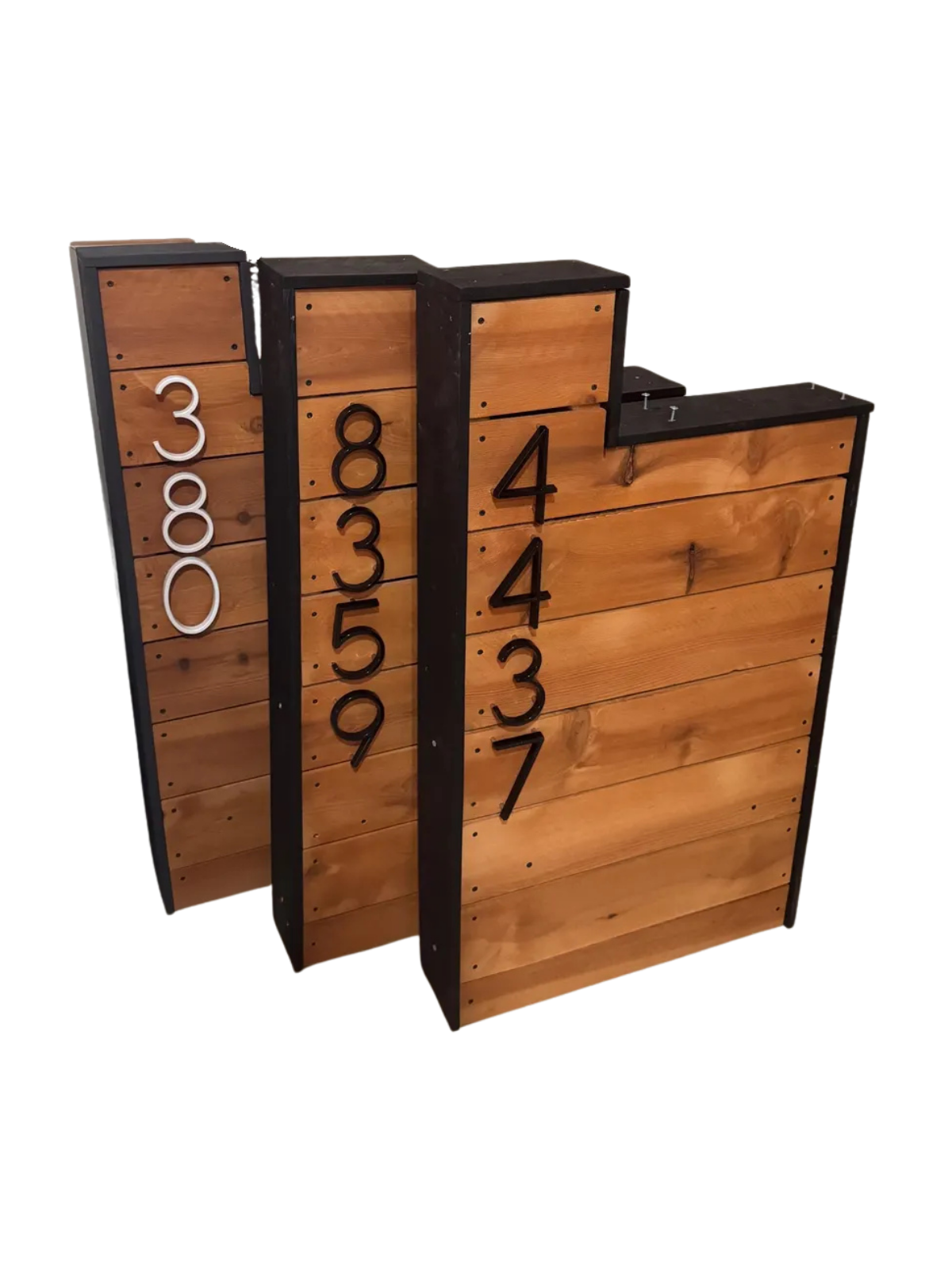 Wooden mailbox post with numbers on a white background