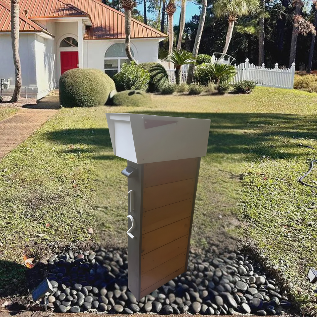 Mailbox post on a grassy lawn with a house in the background