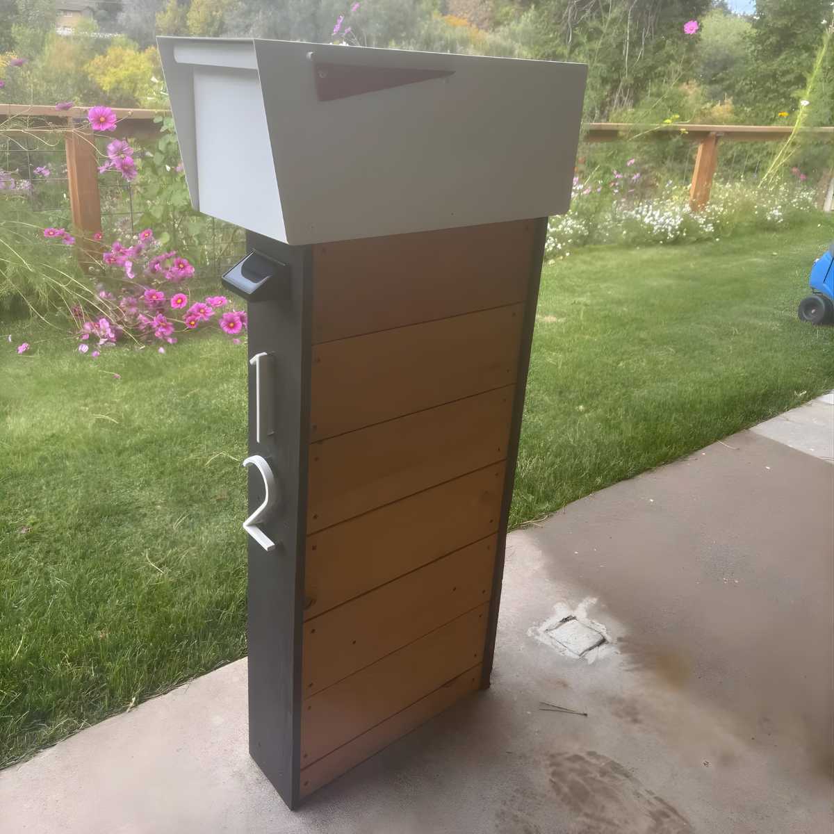 Modern outdoor Mailbox with wooden design on a patio