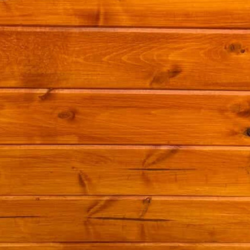 Close-up of a cedar tone wooden surface with visible grain and texture