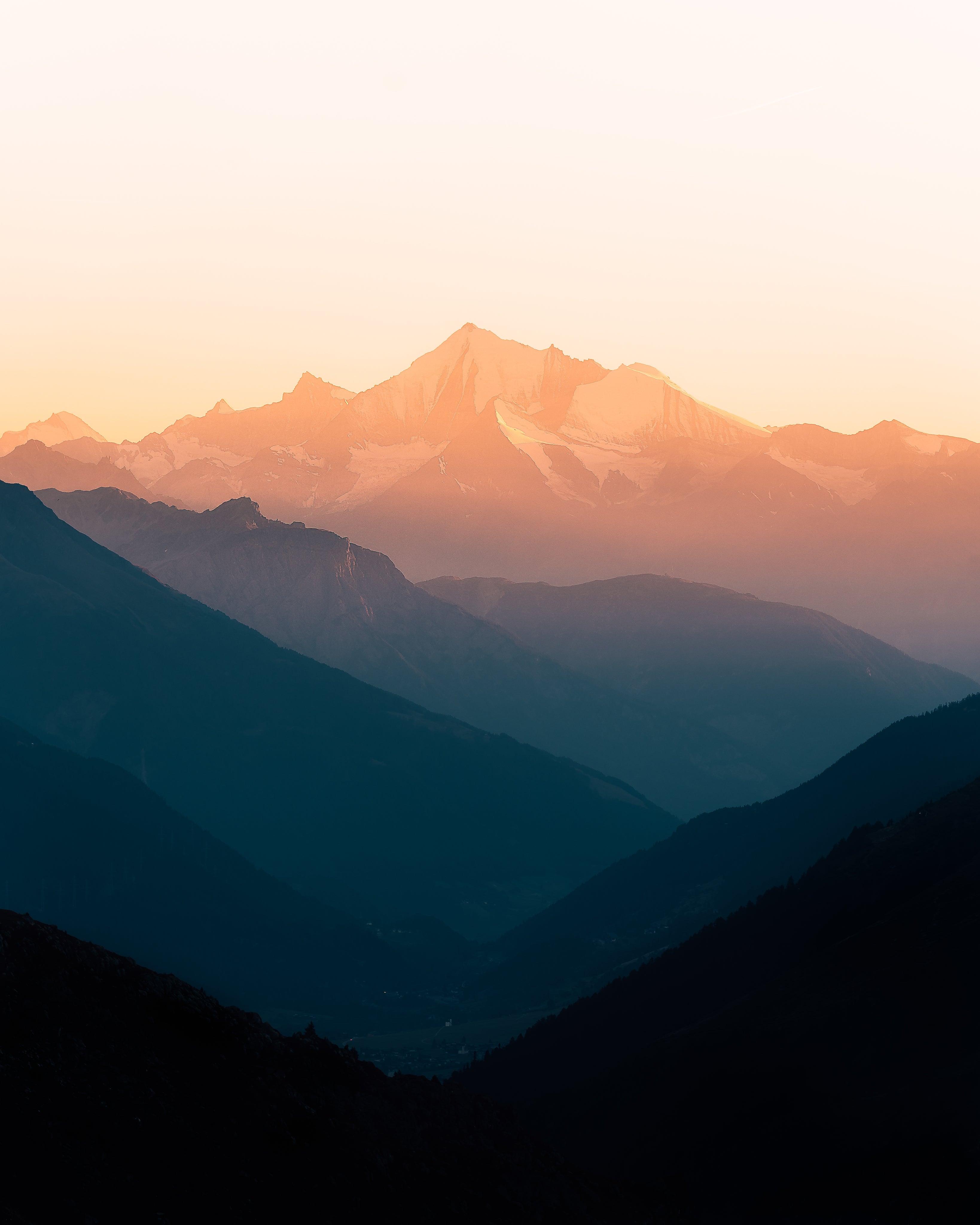 Misty mountain ranges at sunrise